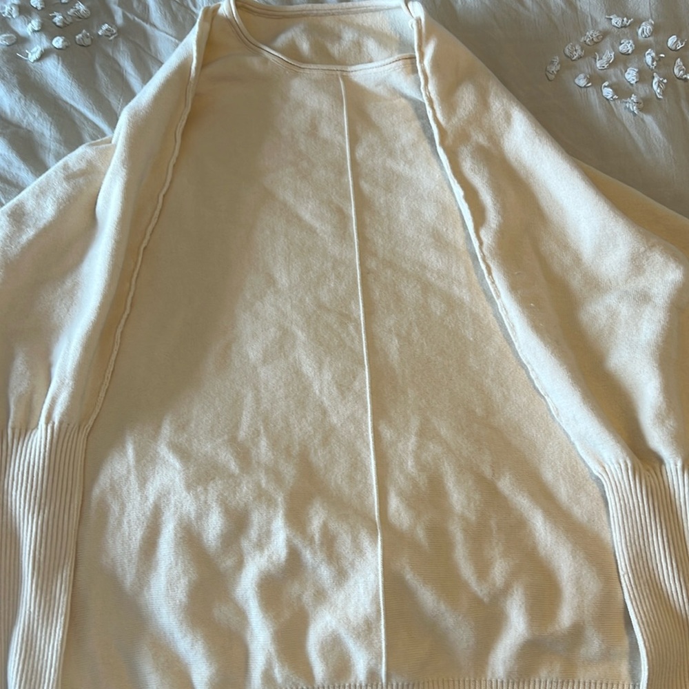 Cream sweater size XXL fits more like XL. Never worn